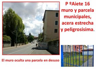 Muro invadiendo la acera y estrechándola